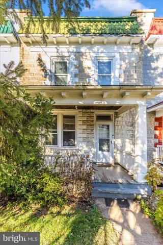 a front view of house with a yard