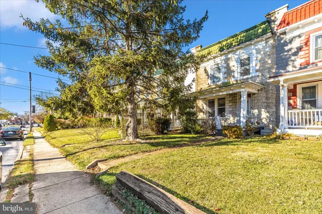 a view of a porch with a table and chairs