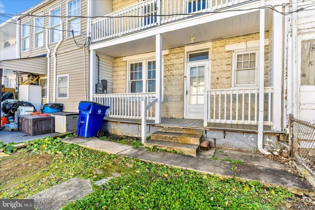 a view of a balcony with wooden floor