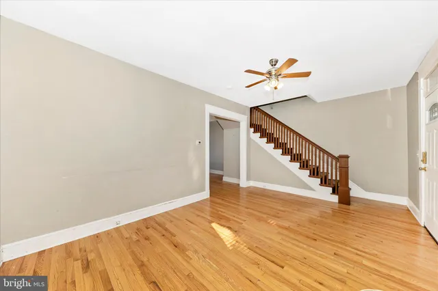 a view of an entryway with wooden floor