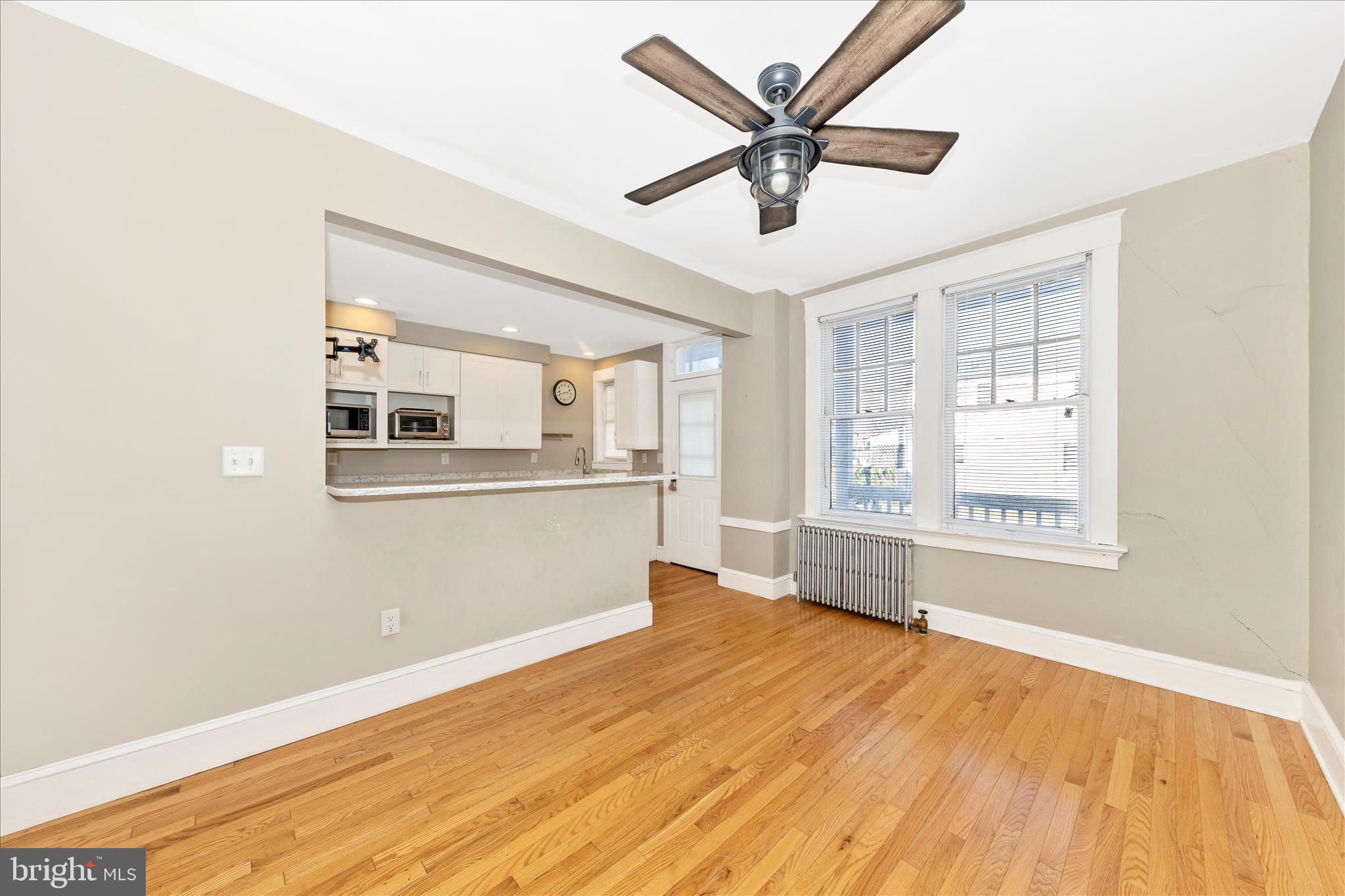 29 East 7th Street Frederick, MD 21701 - Photo 9 of 53 a view of a big room with wooden floor and windows