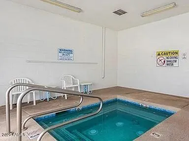 a view of a workspace with furniture and a workspace