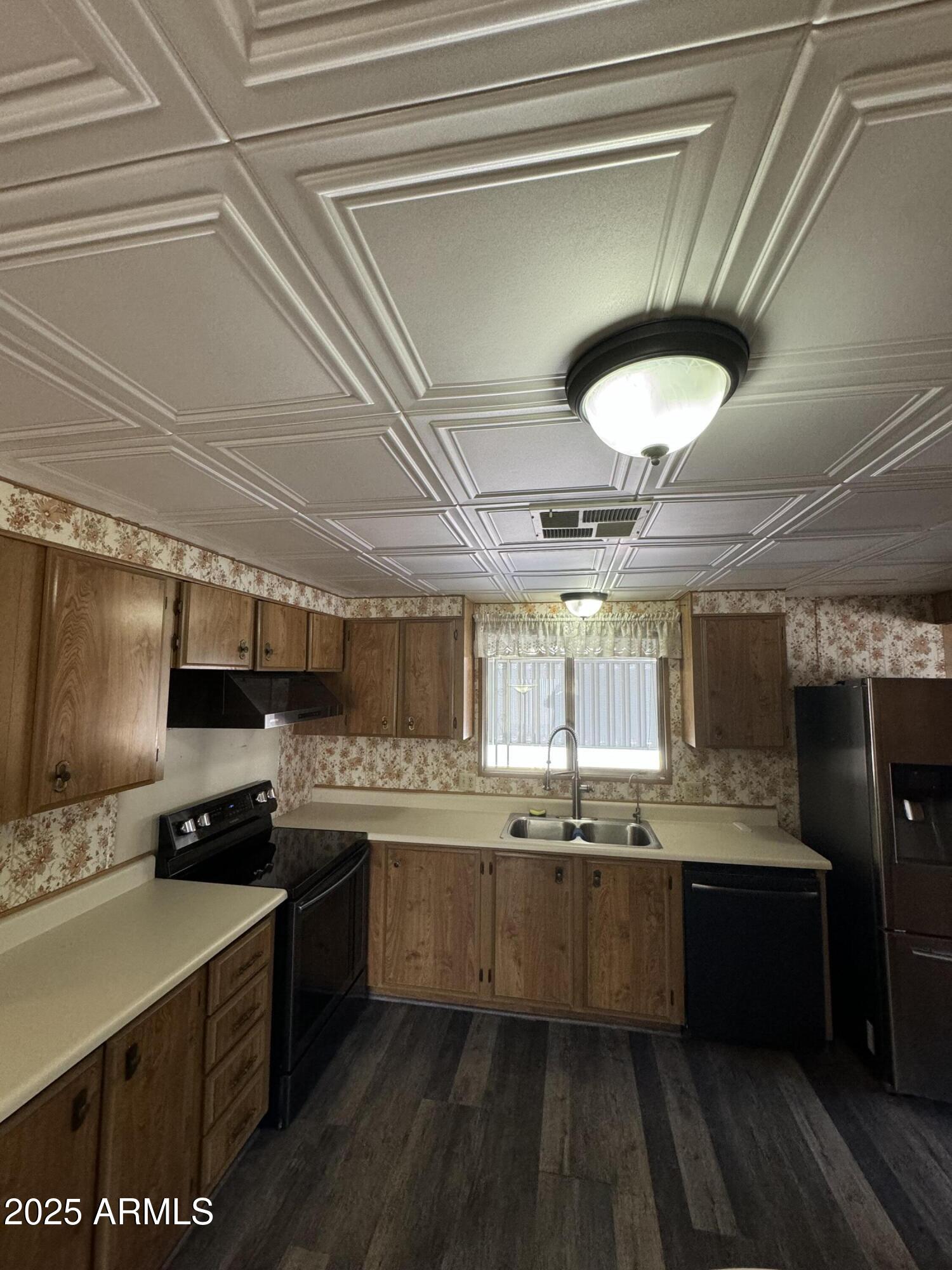 3330 East Main Street, Unit 323 Mesa, AZ 85213 - Photo 3 of 20 a kitchen with stainless steel appliances granite countertop a sink a stove and cabinets