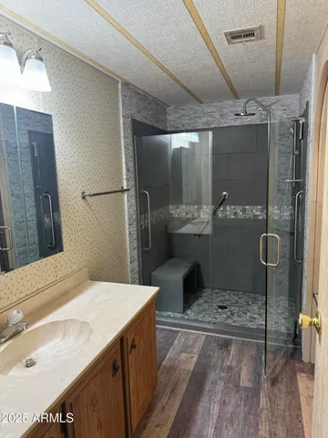 a bathroom with a sink and mirror