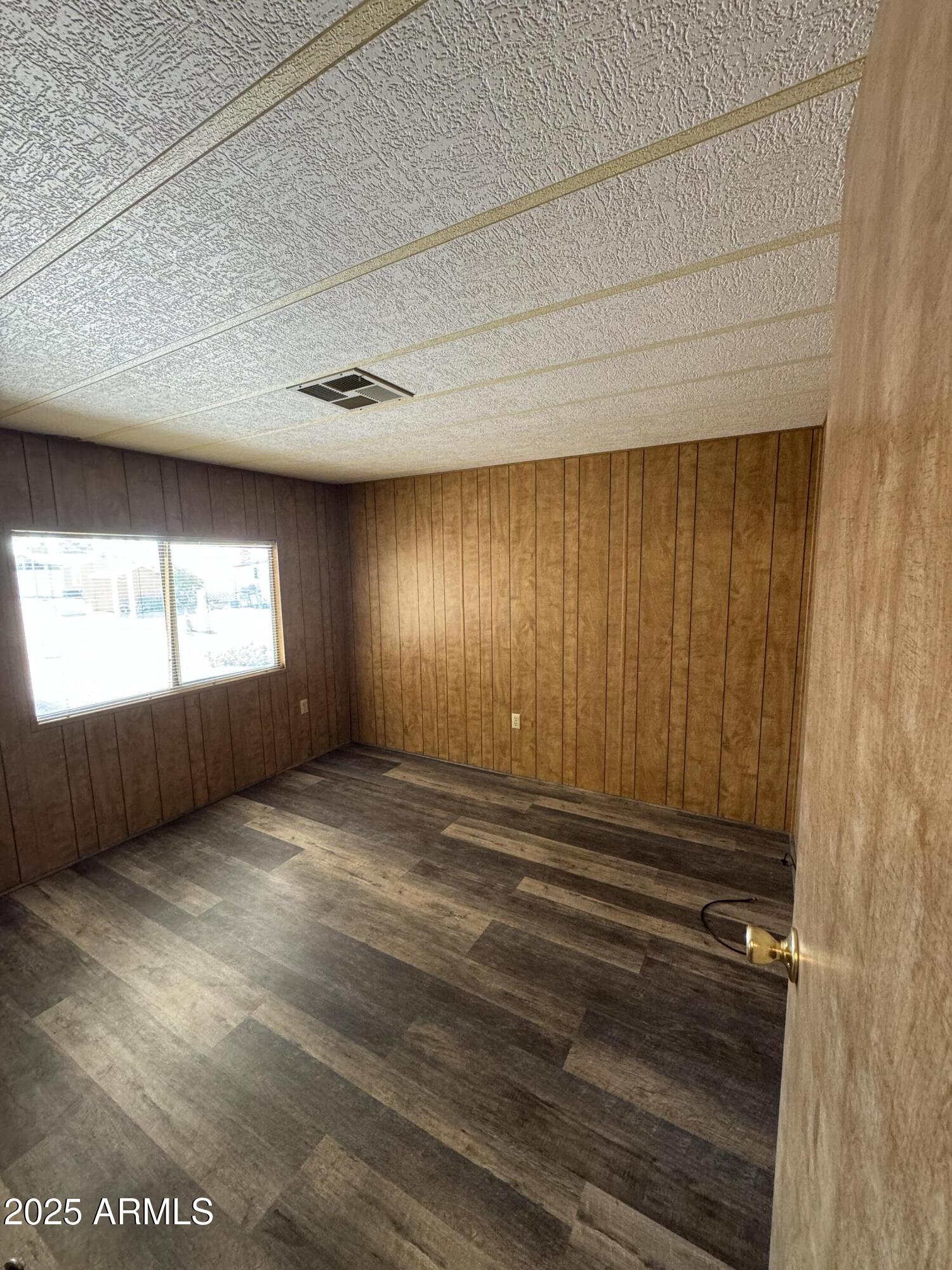 3330 East Main Street, Unit 323 Mesa, AZ 85213 - Photo 9 of 20 a view of an empty room and window