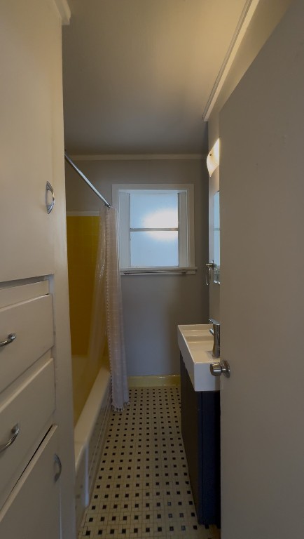 1 East 53rd Street Austin, TX 78751 - Photo 12 of 13 Bathroom with vanity, shower / bath combo, and light floors