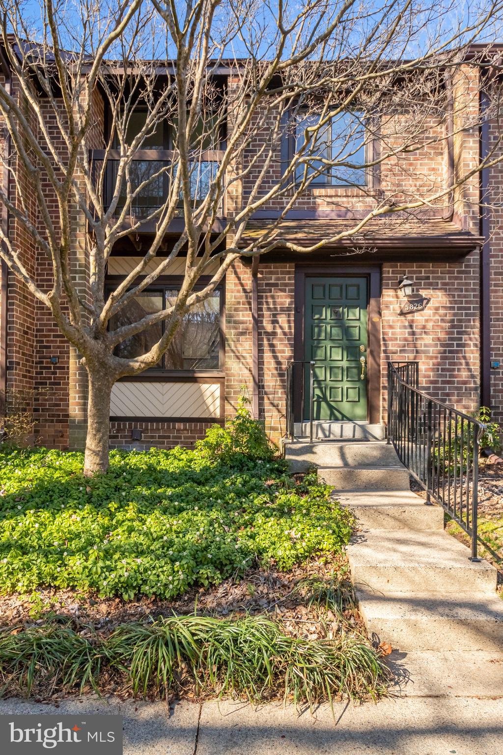 5826 Jackson Oak Court Burke, VA 22015 - Photo 1 of 28 a view of a entrance gate of the house and front of a house