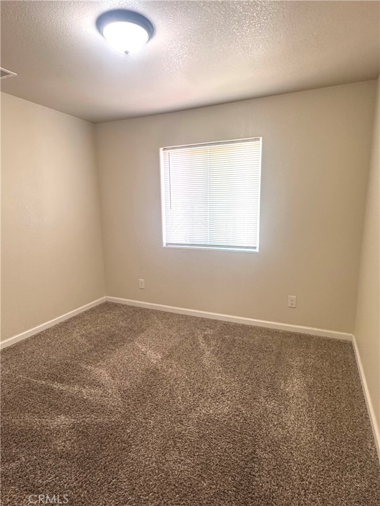 1339 Playa Del Rey Drive Merced, CA 95348 - Photo 33 of 48 an empty room with a window