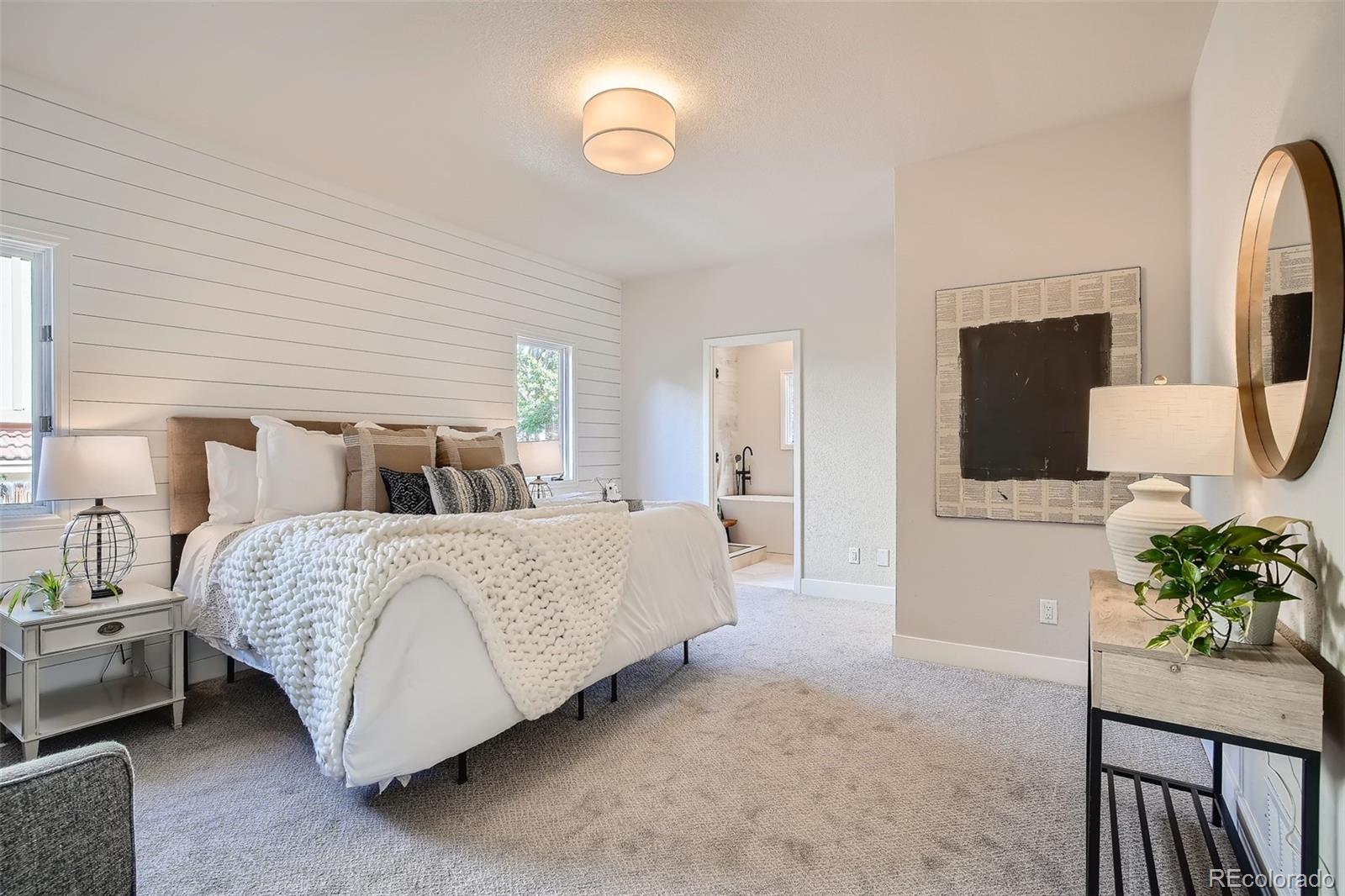 3806 Simms Court Wheat Ridge, CO 80033 - Photo 12 of 30 a bedroom with bed and a potted plant