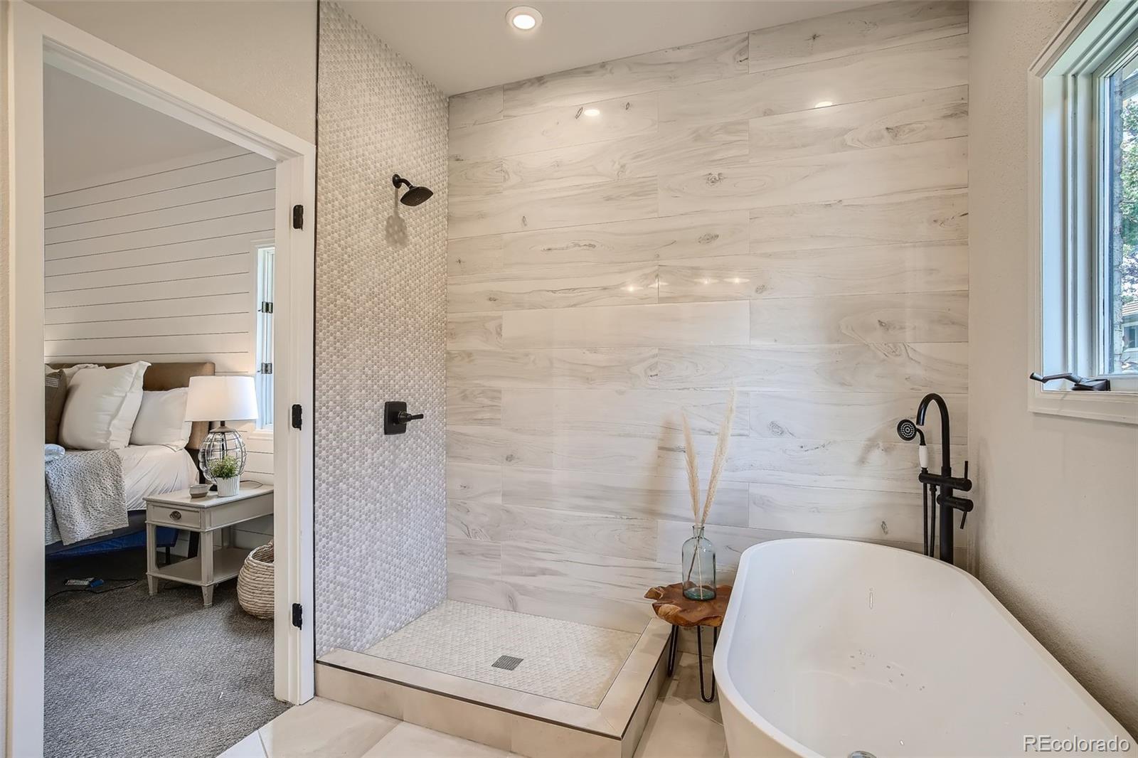 3806 Simms Court Wheat Ridge, CO 80033 - Photo 14 of 30 a bathroom with a shower and a toilet