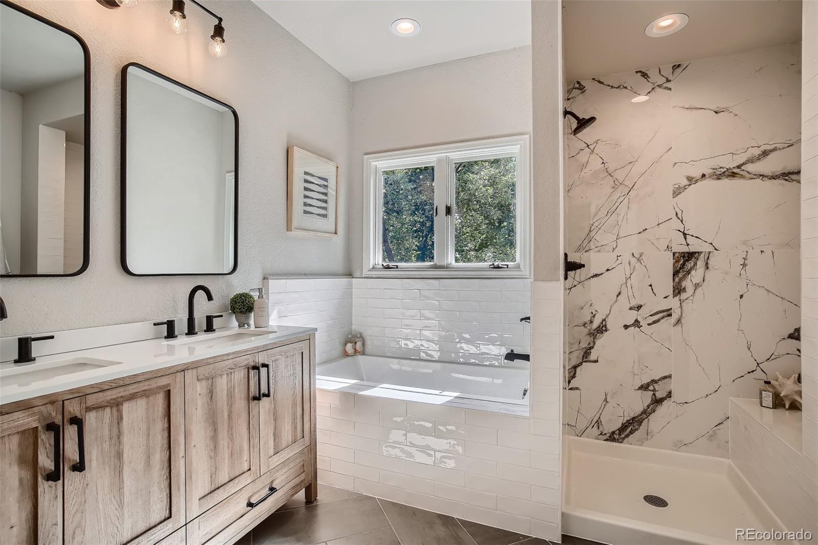 3806 Simms Court Wheat Ridge, CO 80033 - Photo 16 of 30 a bathroom with a bathtub and a sink