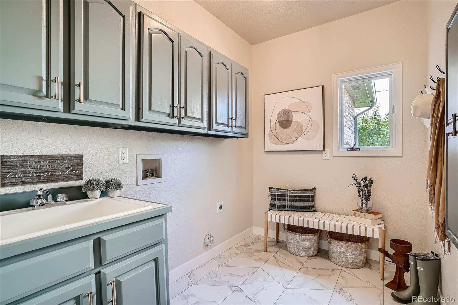 3806 Simms Court Wheat Ridge, CO 80033 - Photo 19 of 30 a bathroom with a sink and a mirror