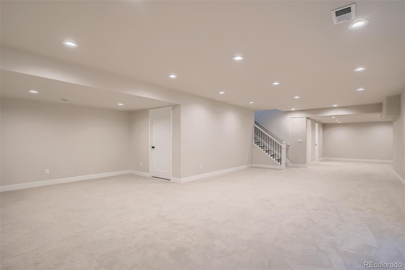 3806 Simms Court Wheat Ridge, CO 80033 - Photo 20 of 30 an empty room with a kitchen