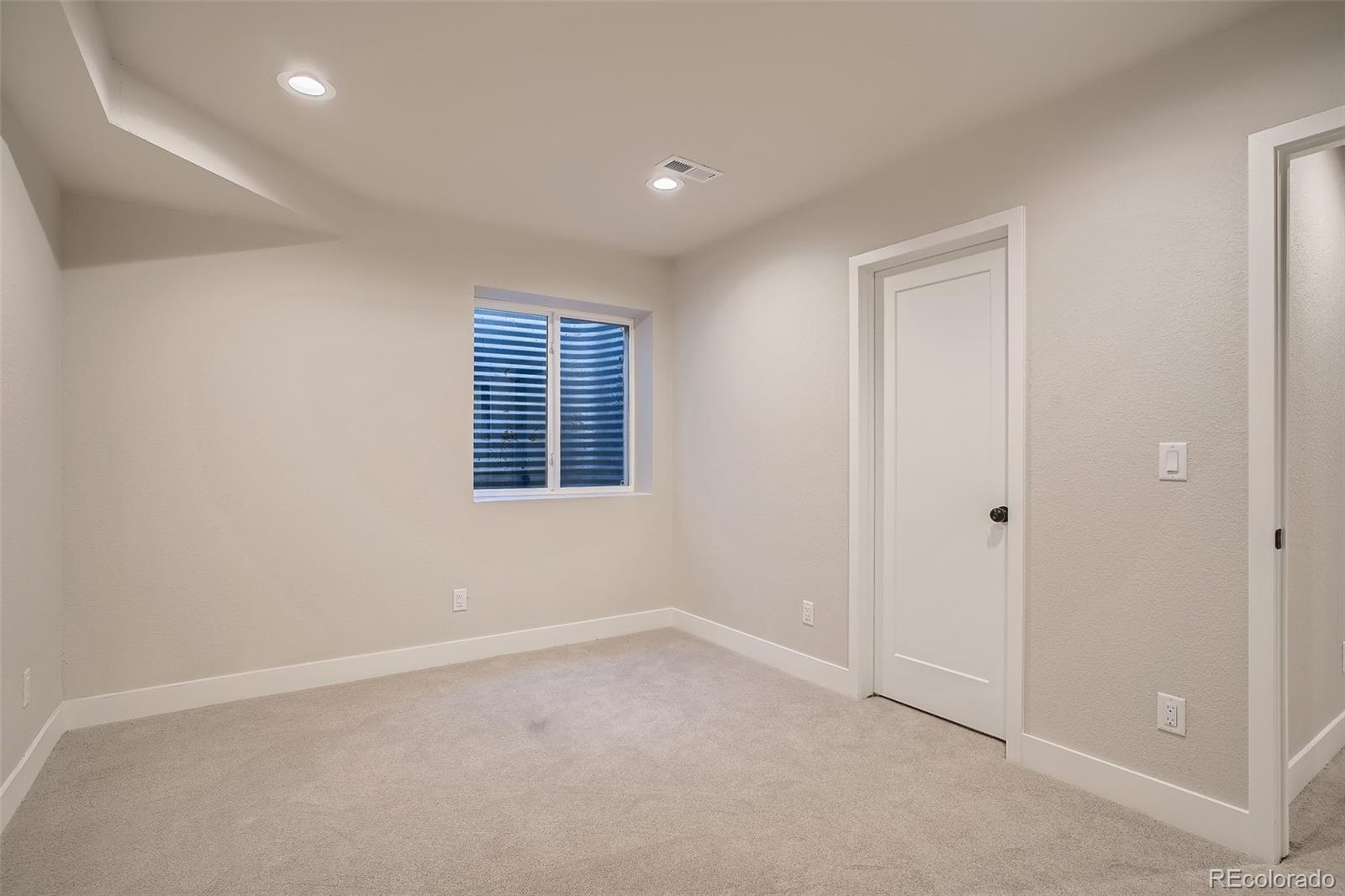 3806 Simms Court Wheat Ridge, CO 80033 - Photo 21 of 30 an empty room with windows