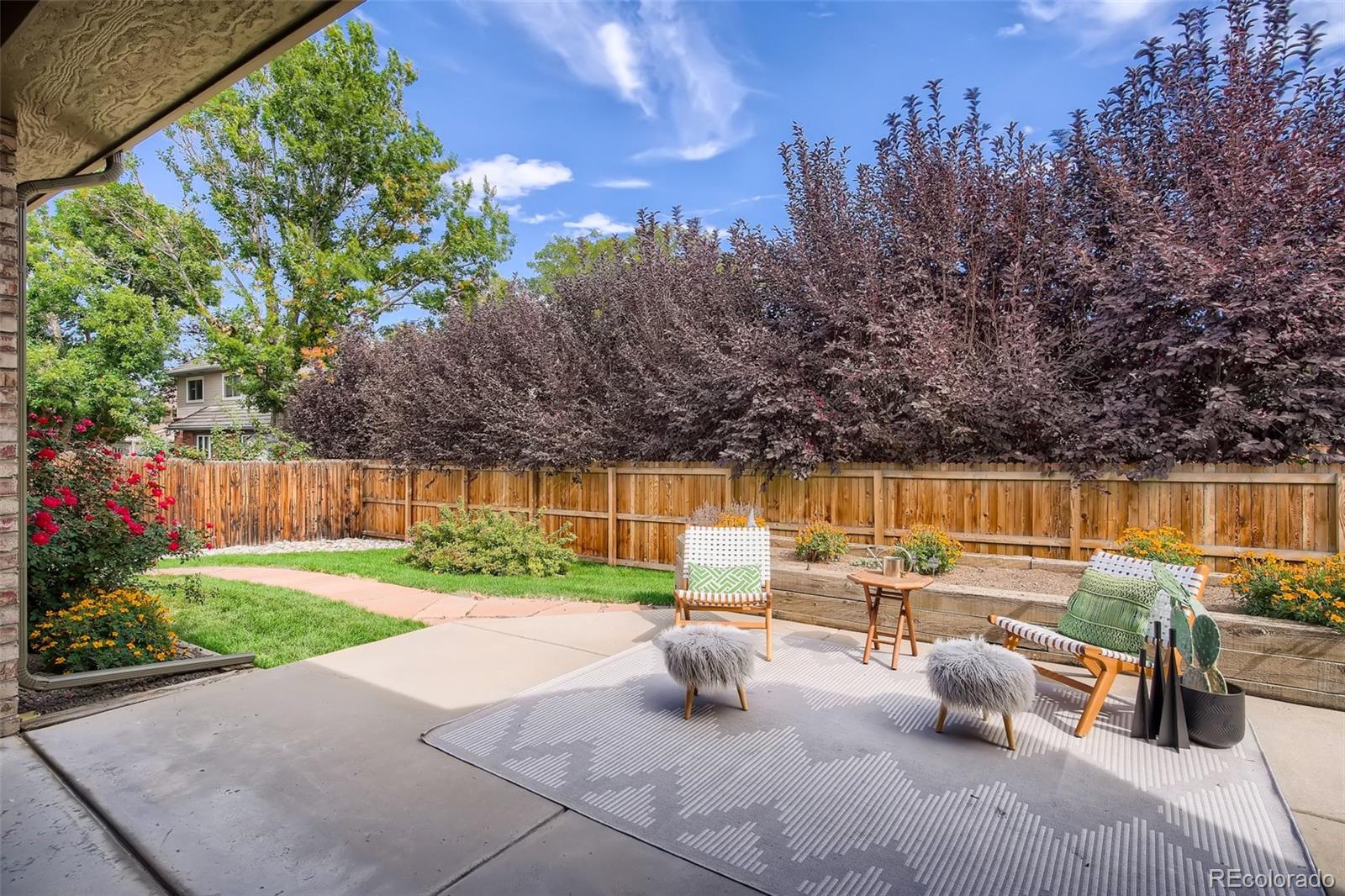 3806 Simms Court Wheat Ridge, CO 80033 - Photo 26 of 30 a view of backyard with swimming pool and seating space