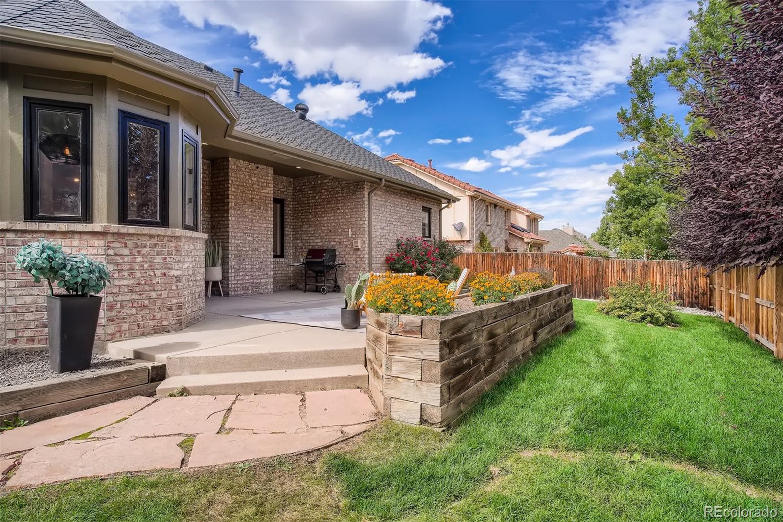 3806 Simms Court Wheat Ridge, CO 80033 - Photo 27 of 30 a view of a porch with furniture and garden