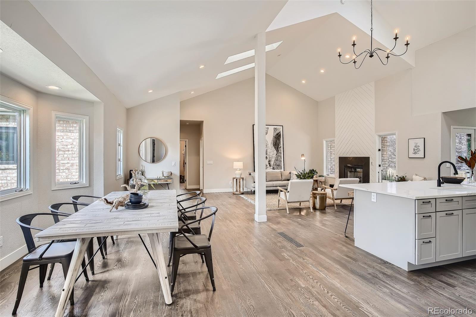 3806 Simms Court Wheat Ridge, CO 80033 - Photo 4 of 30 a view of a dining room with furniture and wooden floor