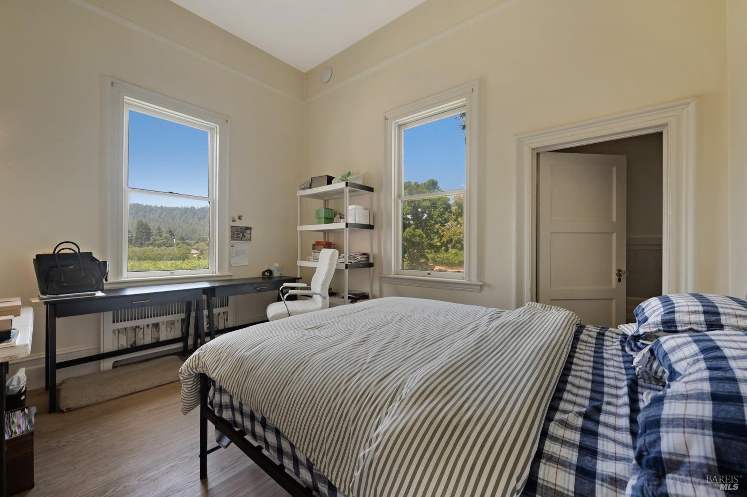 125 Cristo Lane Santa Rosa, CA 95409 - Photo 18 of 82 a bedroom with a bed and a desk