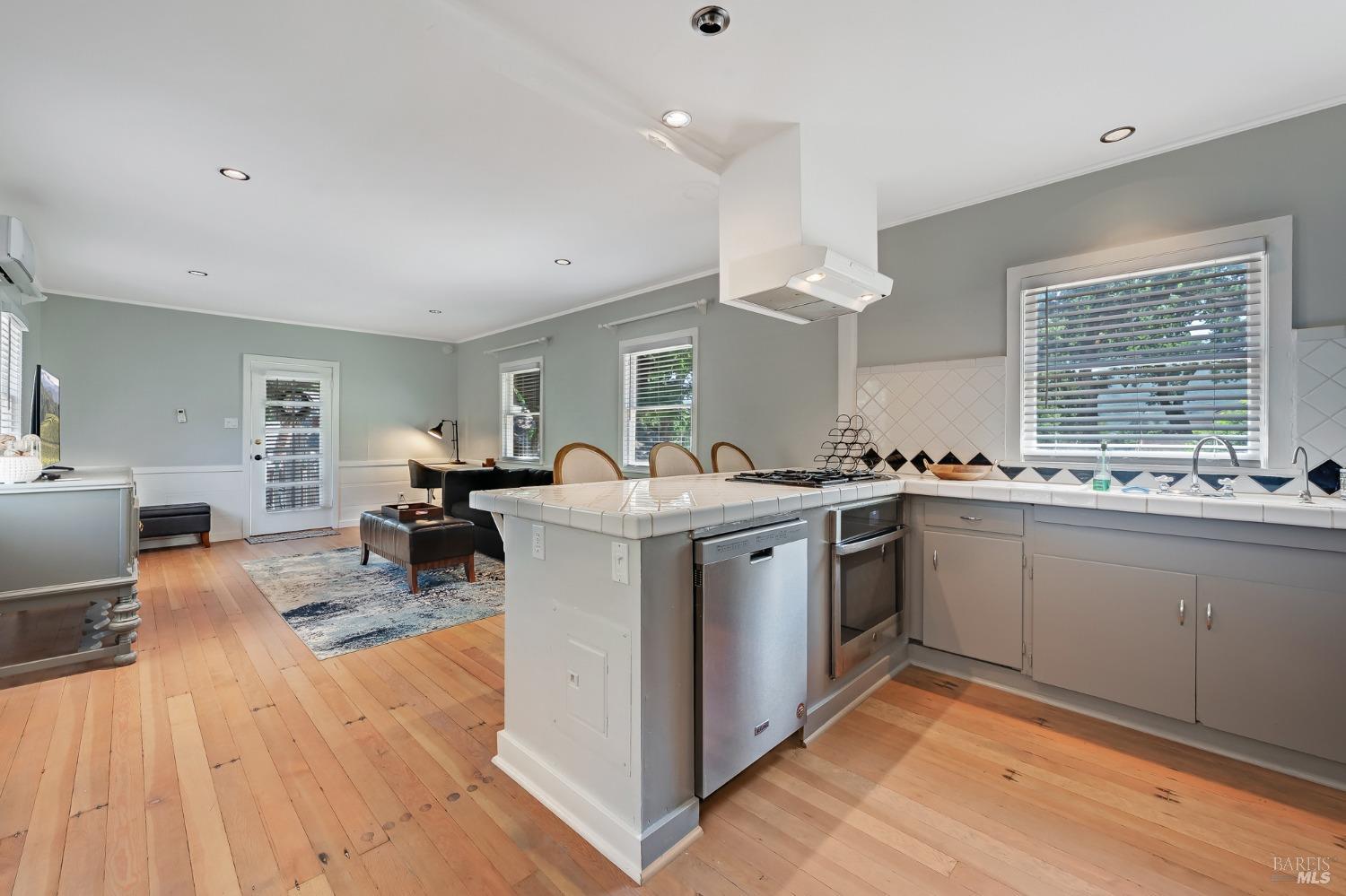 125 Cristo Lane Santa Rosa, CA 95409 - Photo 57 of 82 a kitchen that has a lot of cabinets in it and wooden floor