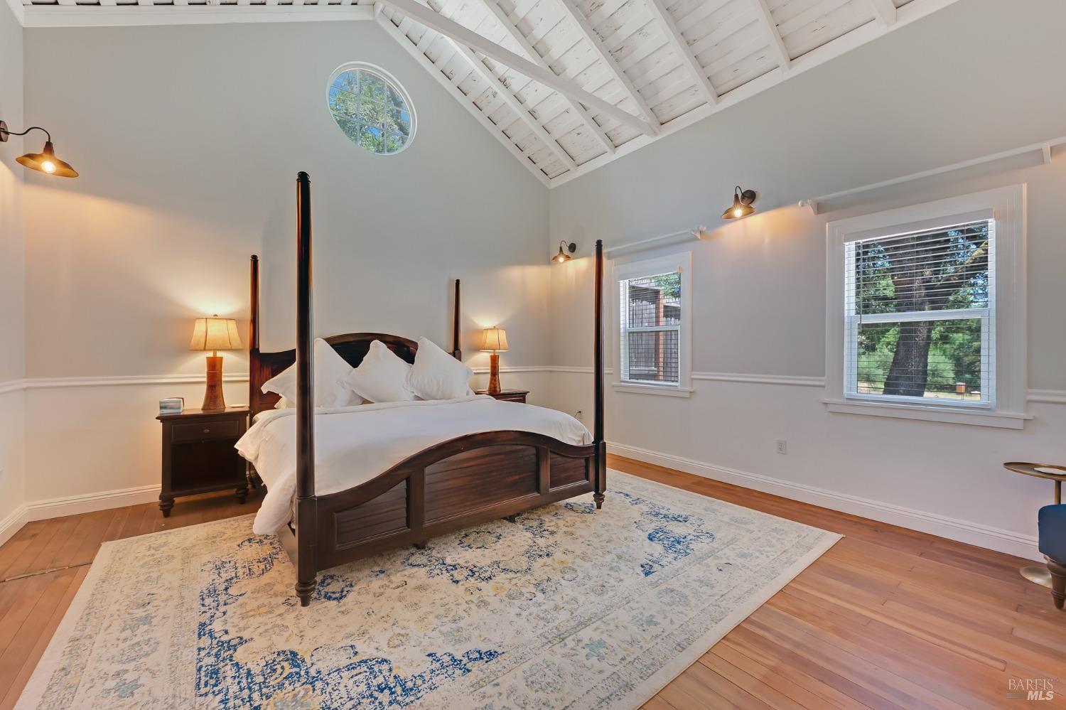 125 Cristo Lane Santa Rosa, CA 95409 - Photo 59 of 82 a bed room with a bed window and a wooden floor