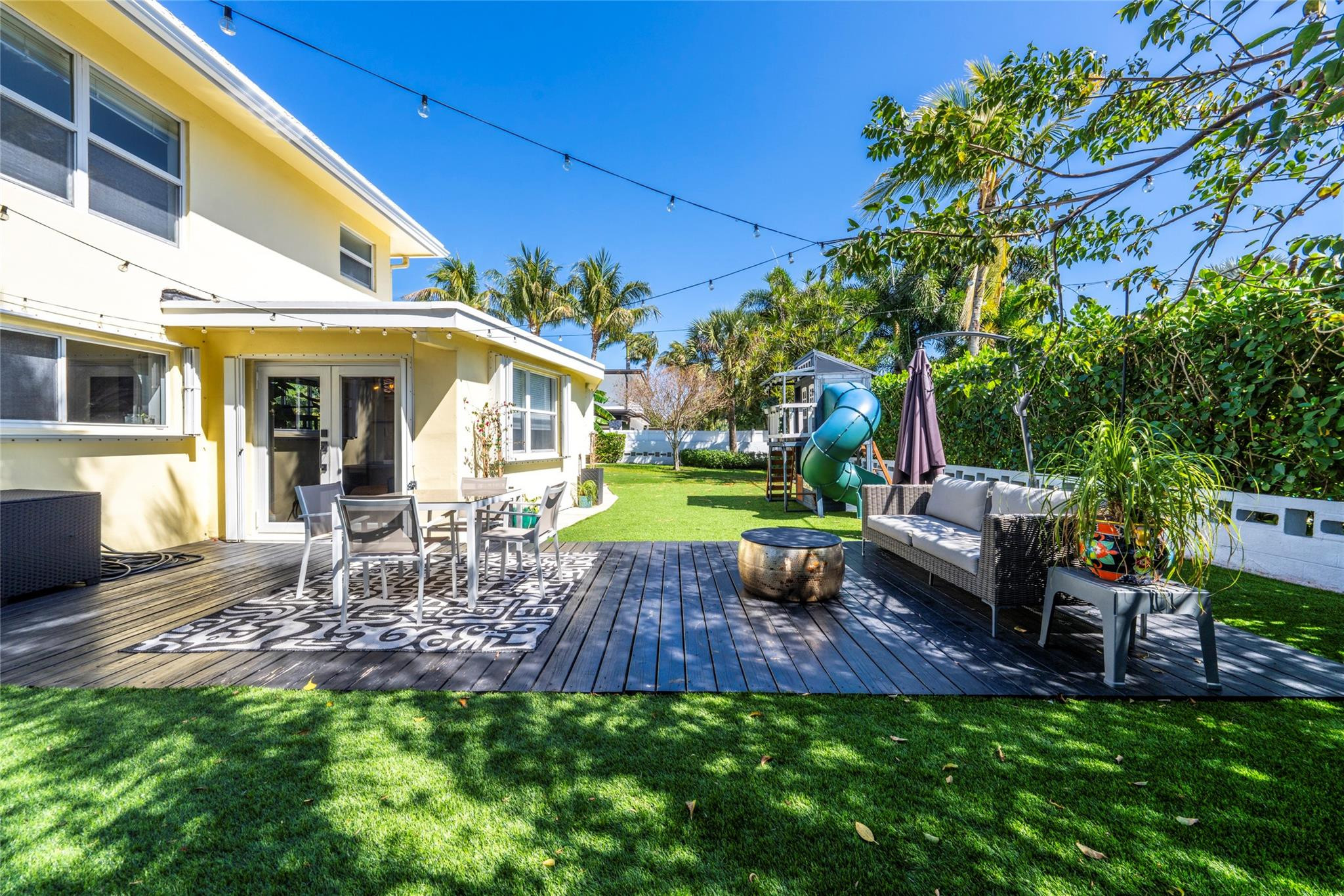 2630 Northeast 25th Street Lighthouse Point, FL 33064 - Photo 5 of 37 a view of a backyard with sitting area