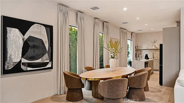 a dining room with furniture and window