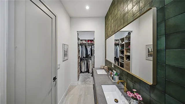 a view of hallway with furniture and stairs