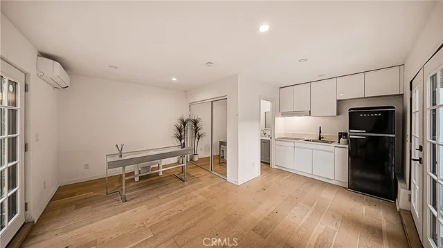 a kitchen with a refrigerator and a sink