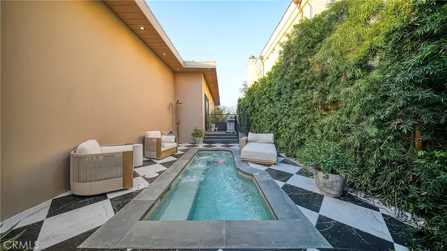swimming pool view with seating space