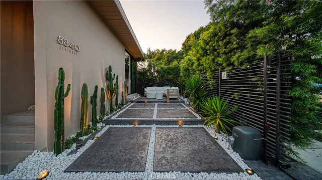 a view of a patio with chair and tables