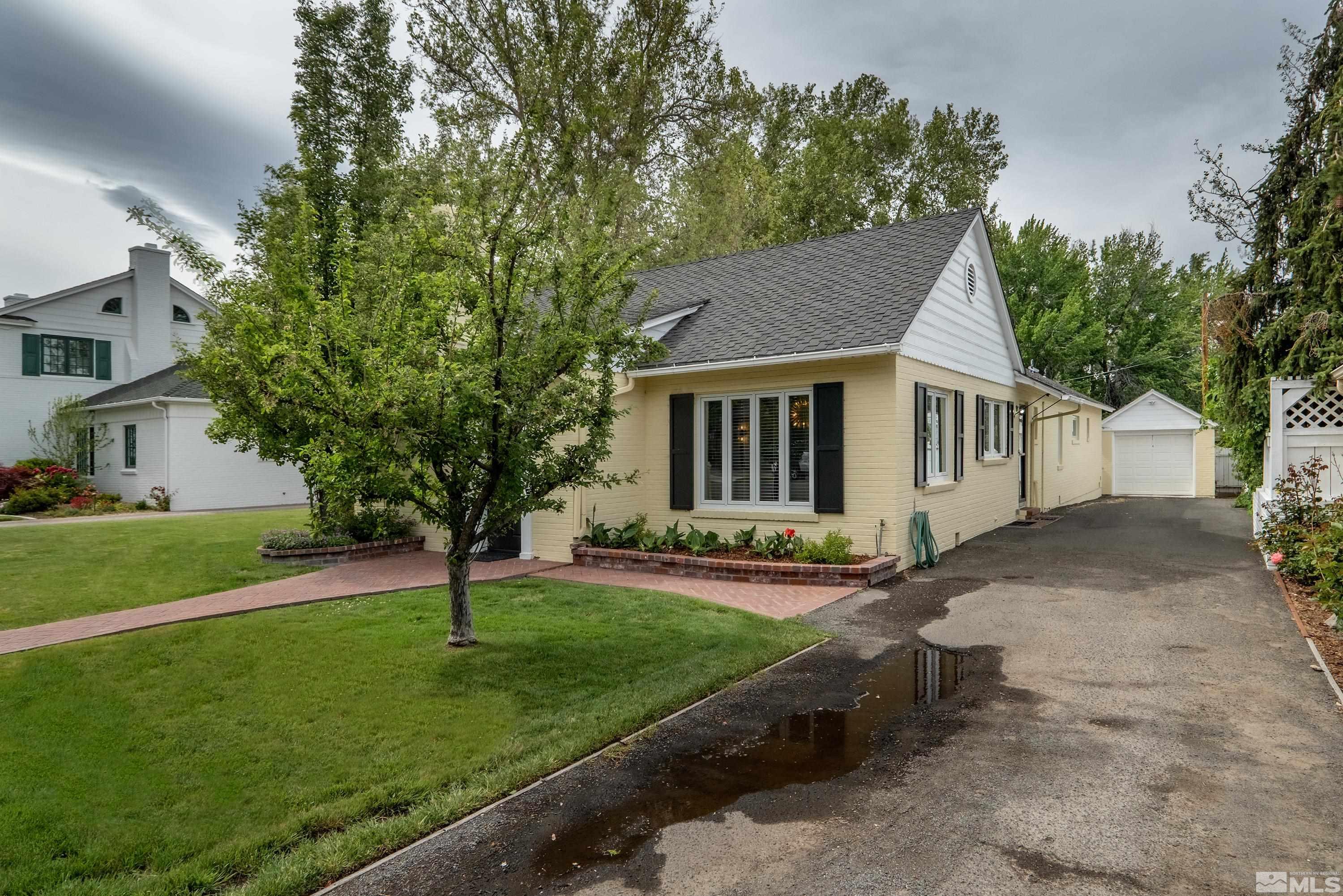 1019 La Rue Avenue Reno, NV 89509 - Photo 18 of 24 a view of a yard in front of a house with plants and large tree