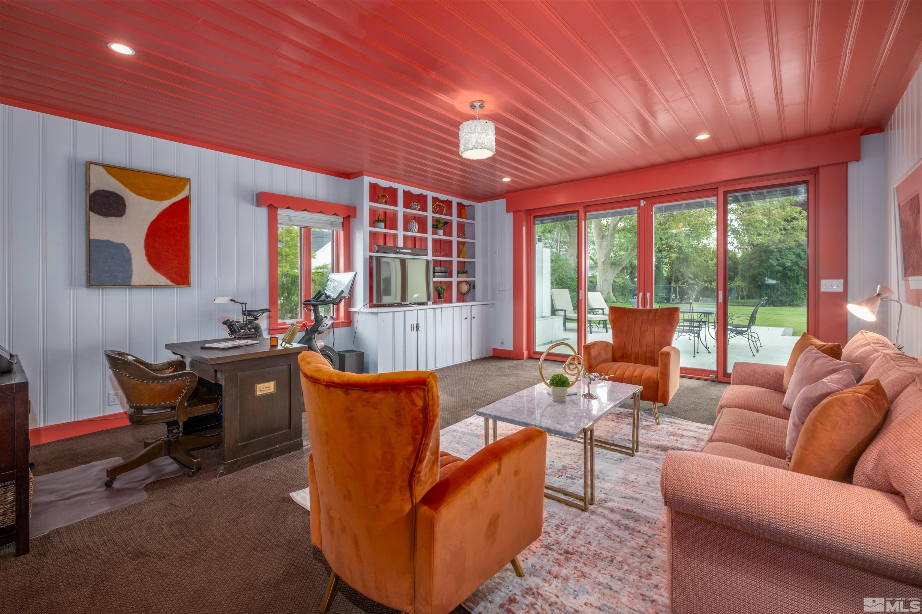 1019 La Rue Avenue Reno, NV 89509 - Photo 4 of 24 a living room with furniture a ceiling fan and a large window
