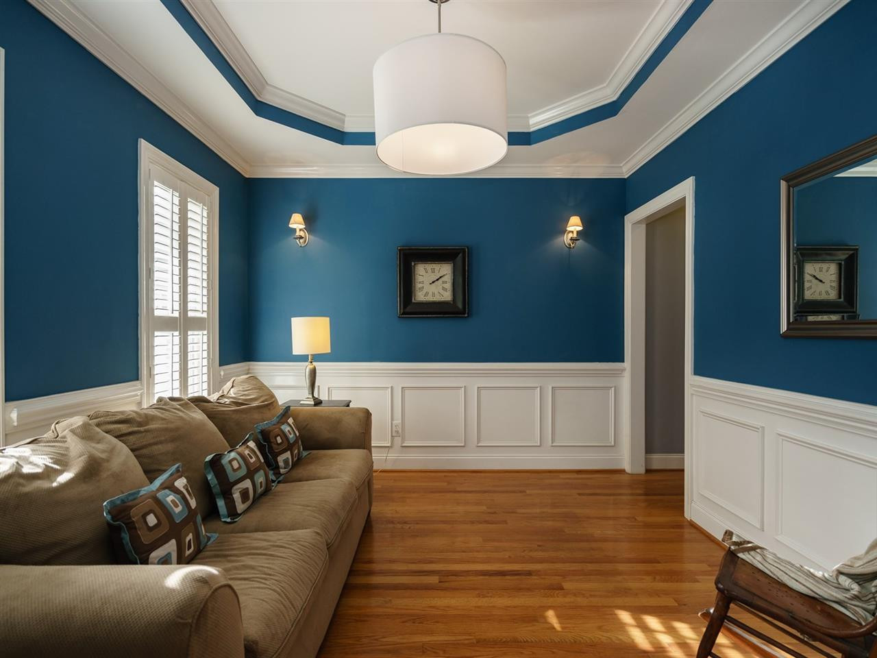 1105 Patterson Grove Road Apex, NC 27502 - Photo 3 of 25 The formal living room boasts a trey ceiling, wainscoting and beautiful hardwood floors. Living Room