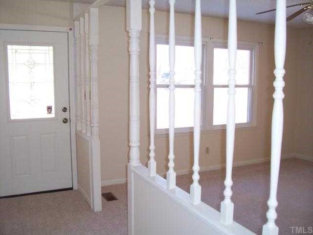 1308 Riverview Road Raleigh, NC 27610 - Photo 2 of 11 a view of an entryway with wooden floor