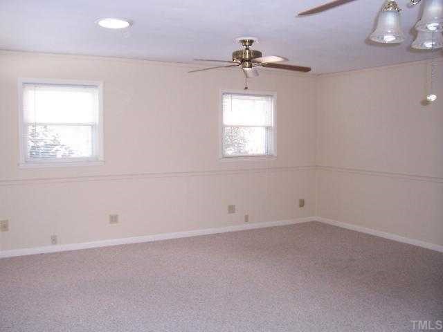1308 Riverview Road Raleigh, NC 27610 - Photo 6 of 11 an empty room with a window