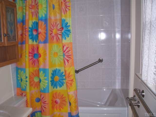 1308 Riverview Road Raleigh, NC 27610 - Photo 8 of 11 a bathroom with a shower