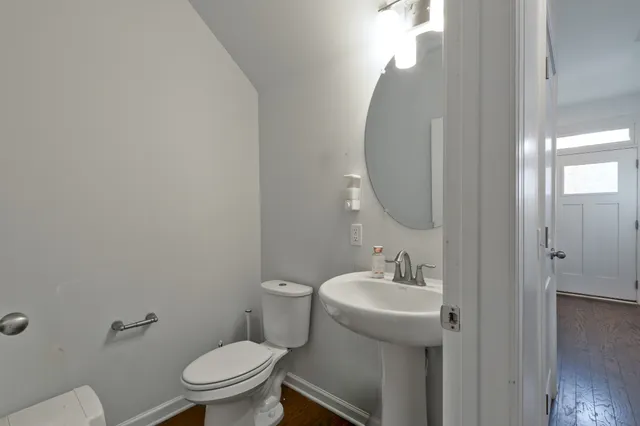 a bedroom with a bed and a mirror