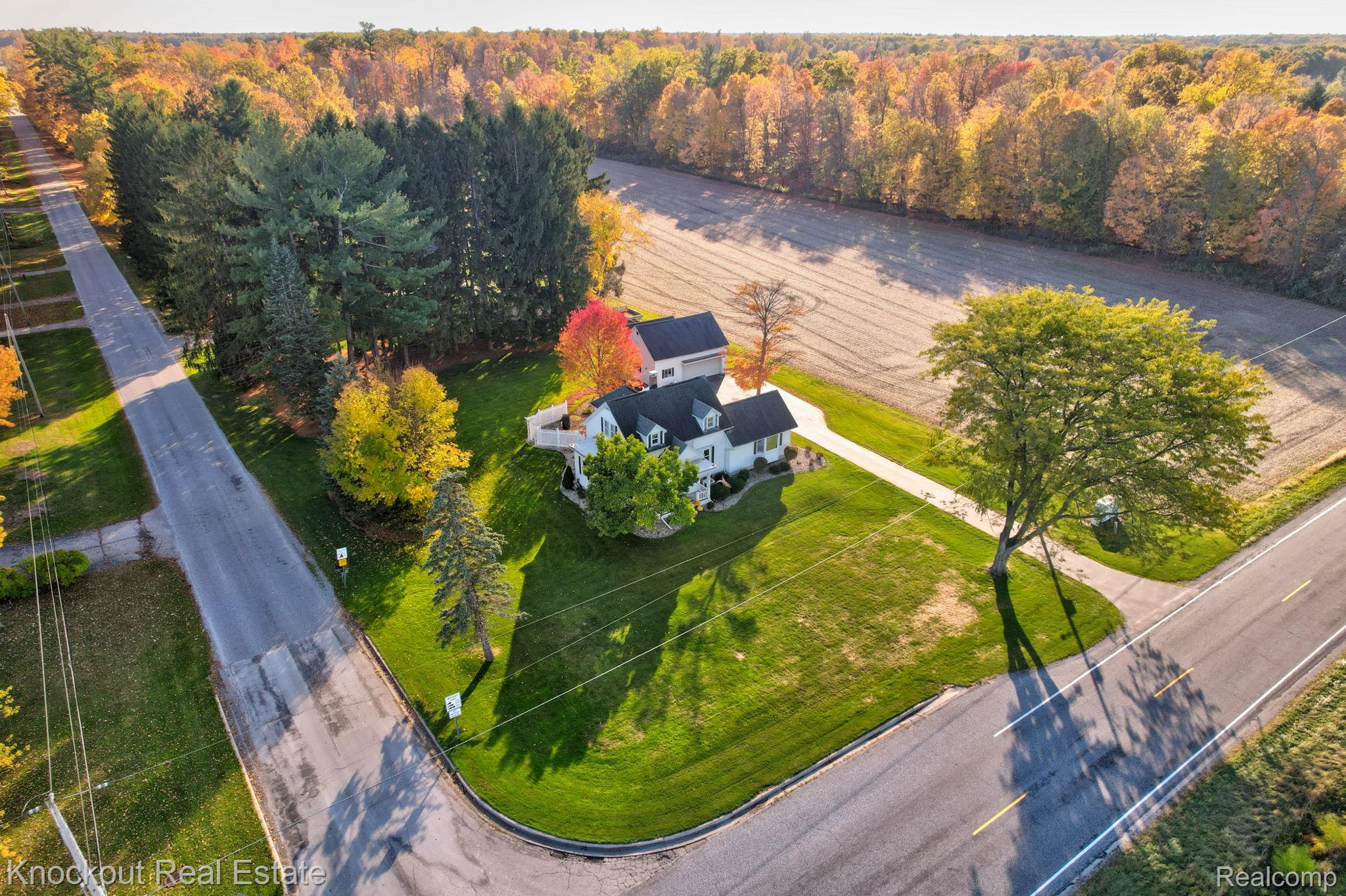 8980 Curtis Road Frankenmuth, MI 48734 - Photo 55 of 56 Drone / aerial view of a heavily wooded area