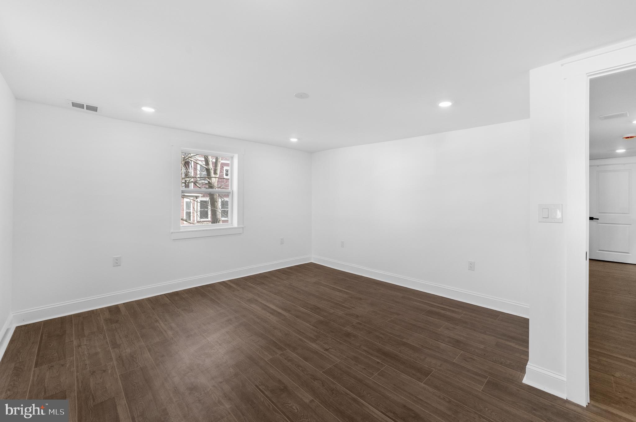 15 West Main Street Marlton, NJ 08053 - Photo 20 of 38 an empty room with wooden floor and windows