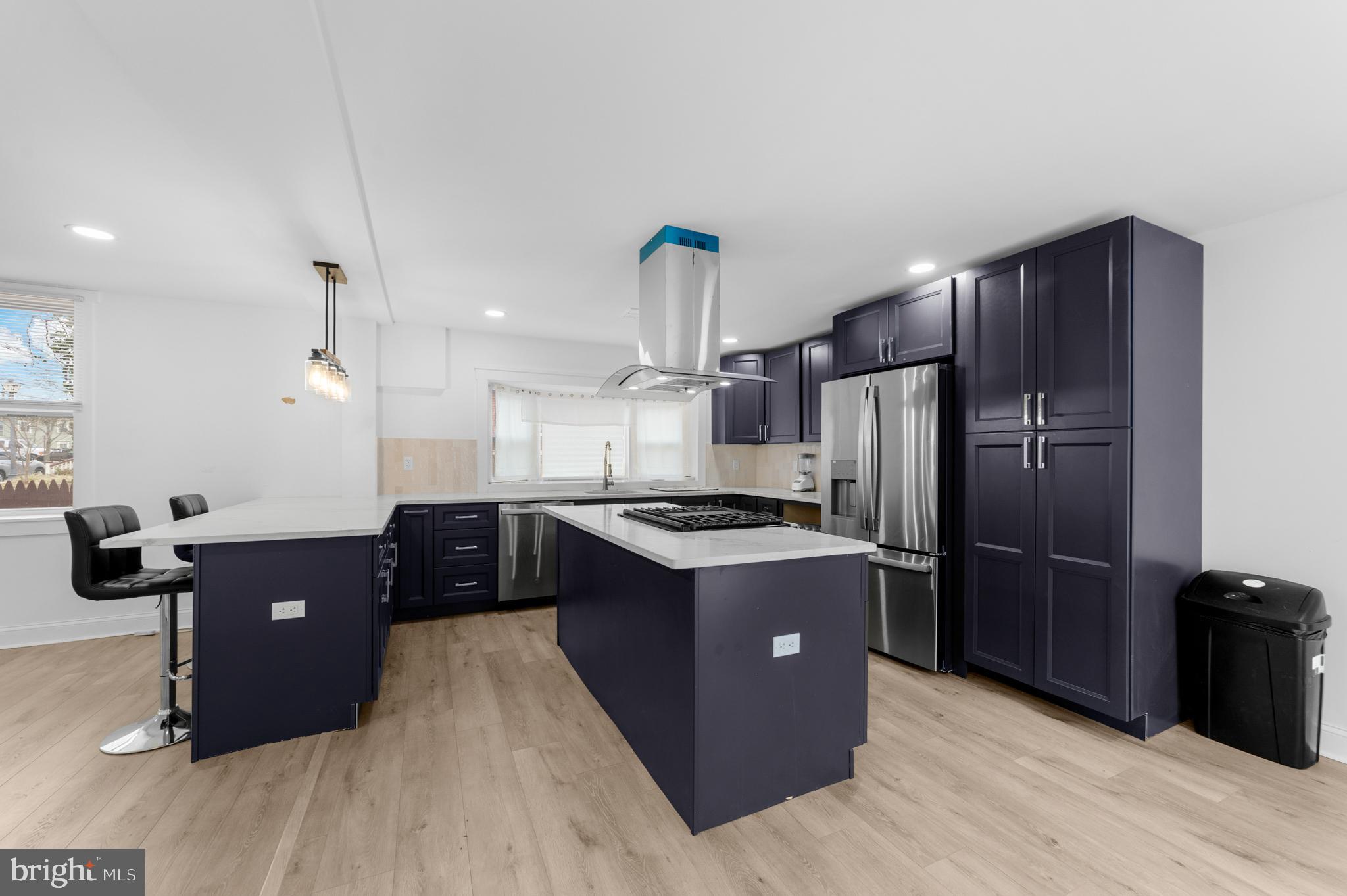 15 West Main Street Marlton, NJ 08053 - Photo 2 of 38 a kitchen with kitchen island wooden cabinets and stainless steel appliances