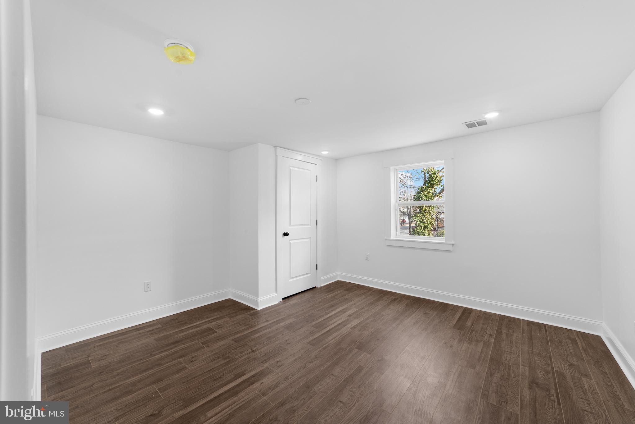 15 West Main Street Marlton, NJ 08053 - Photo 23 of 38 a view of an empty room with wooden floor and window