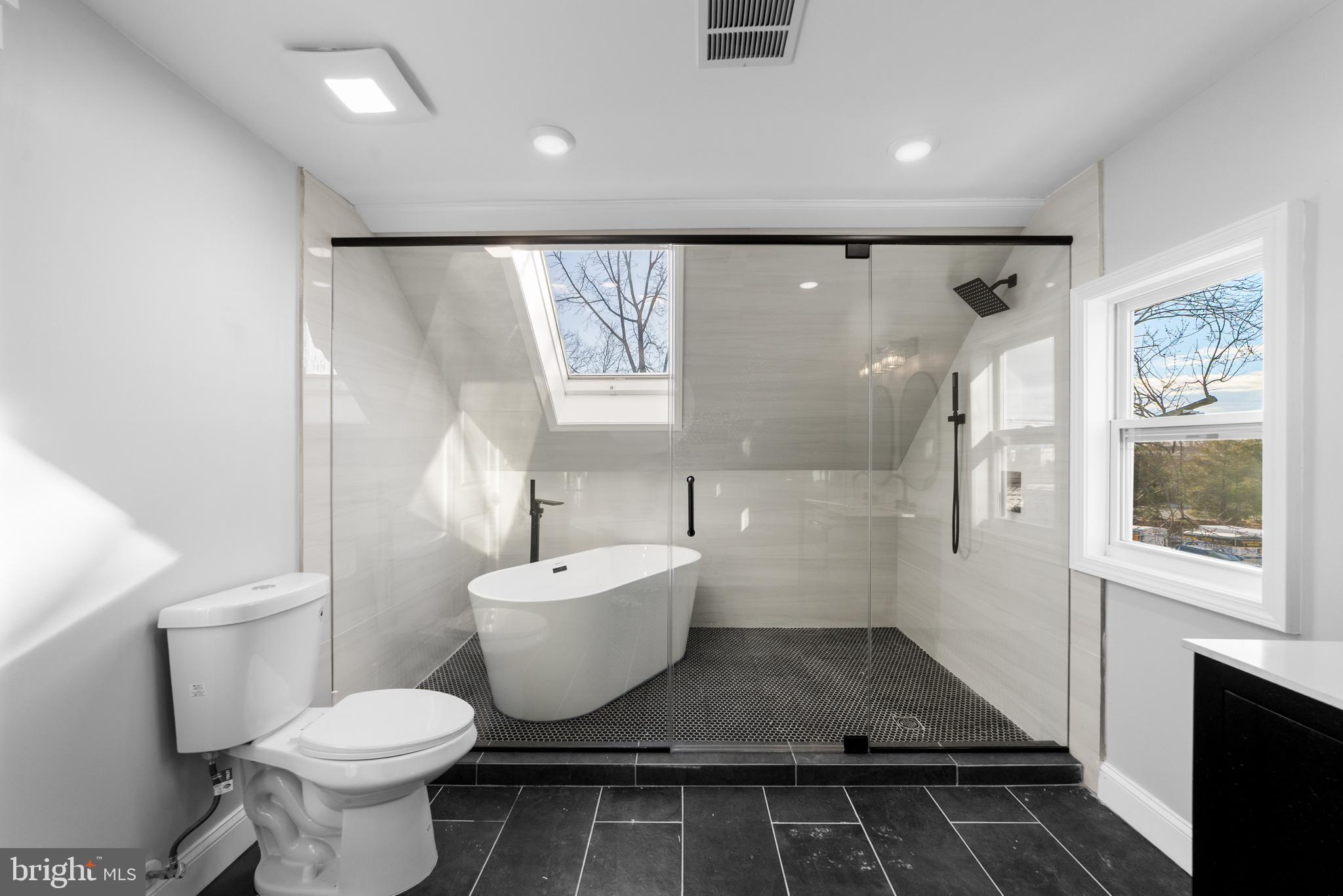 15 West Main Street Marlton, NJ 08053 - Photo 29 of 38 a bathroom with a toilet sink and a large mirror