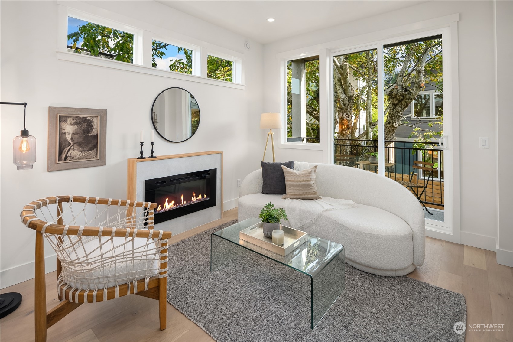 8809 B Wallingford Avenue North Seattle, WA 98103 - Photo 11 of 17 a living room with furniture a large window and a fireplace