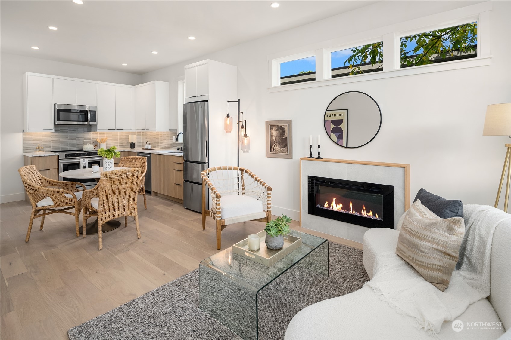 8809 B Wallingford Avenue North Seattle, WA 98103 - Photo 12 of 17 a living room with furniture a clock and a fireplace