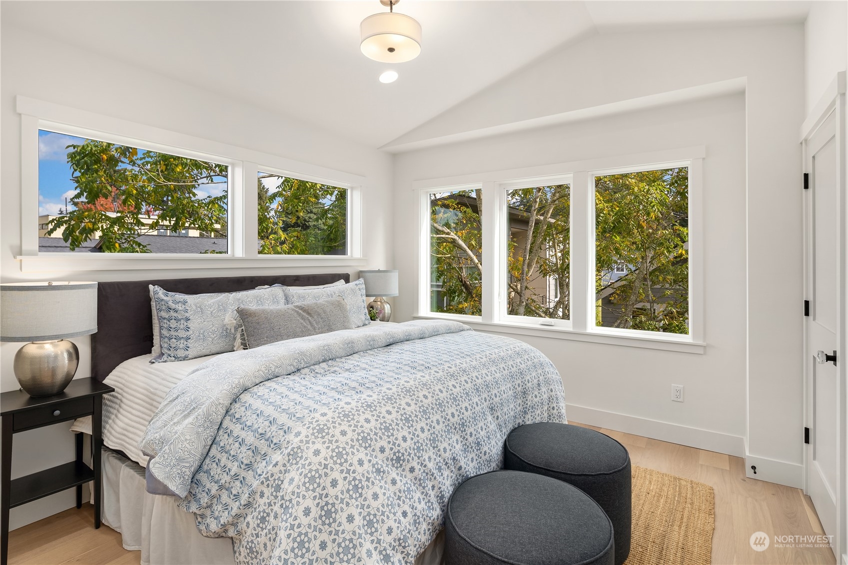 8809 B Wallingford Avenue North Seattle, WA 98103 - Photo 14 of 17 a bedroom with a bed and a large window
