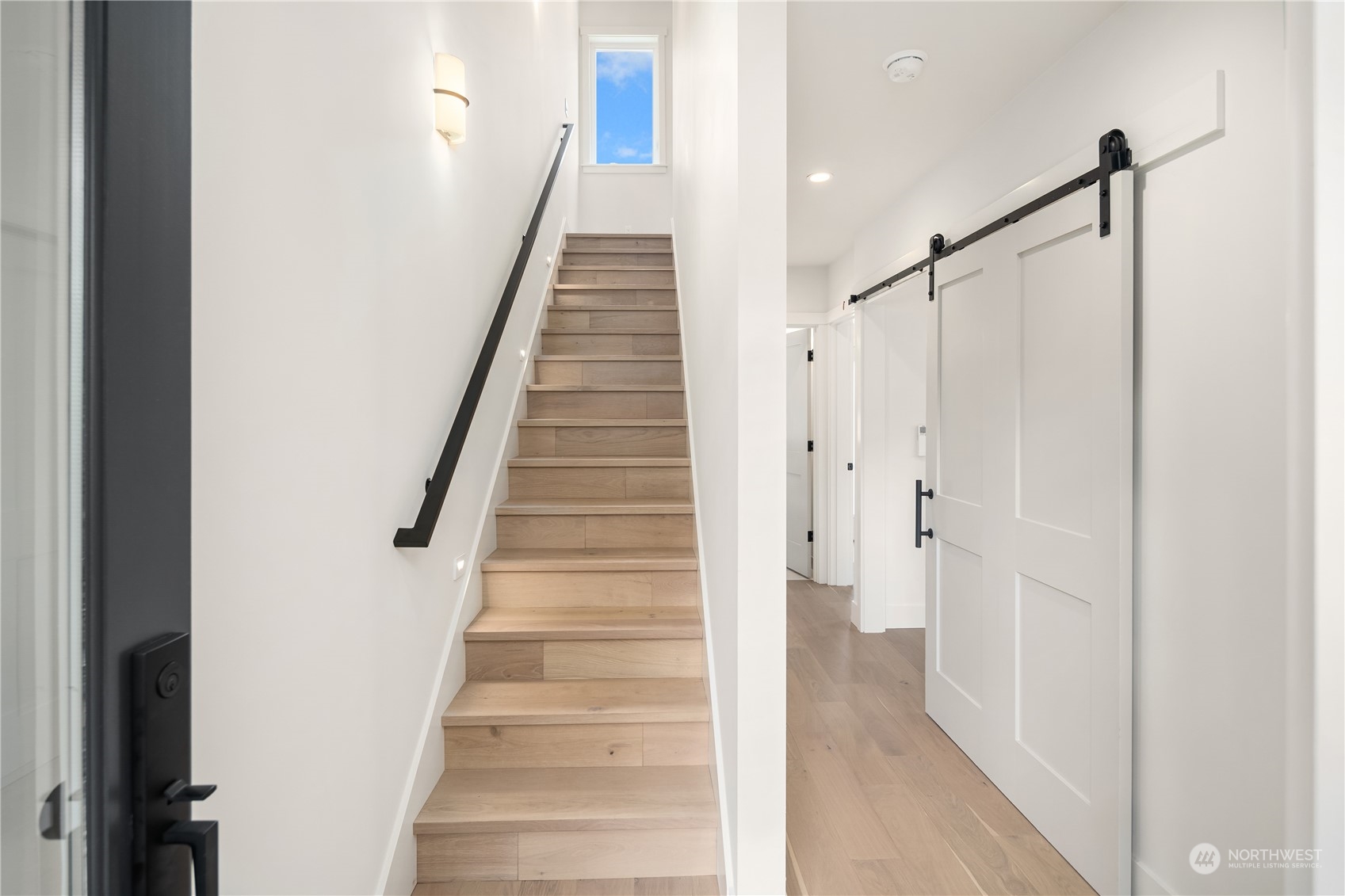 8809 B Wallingford Avenue North Seattle, WA 98103 - Photo 2 of 17 a view of a hallway with staircase