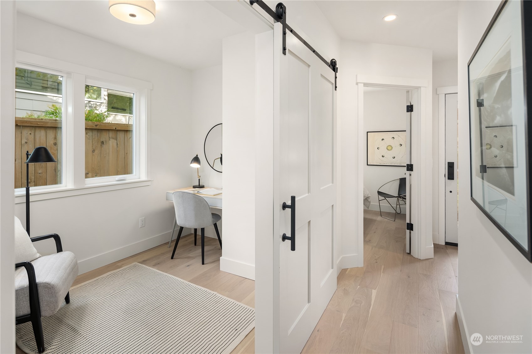 8809 B Wallingford Avenue North Seattle, WA 98103 - Photo 4 of 17 a view of a livingroom with furniture and windows