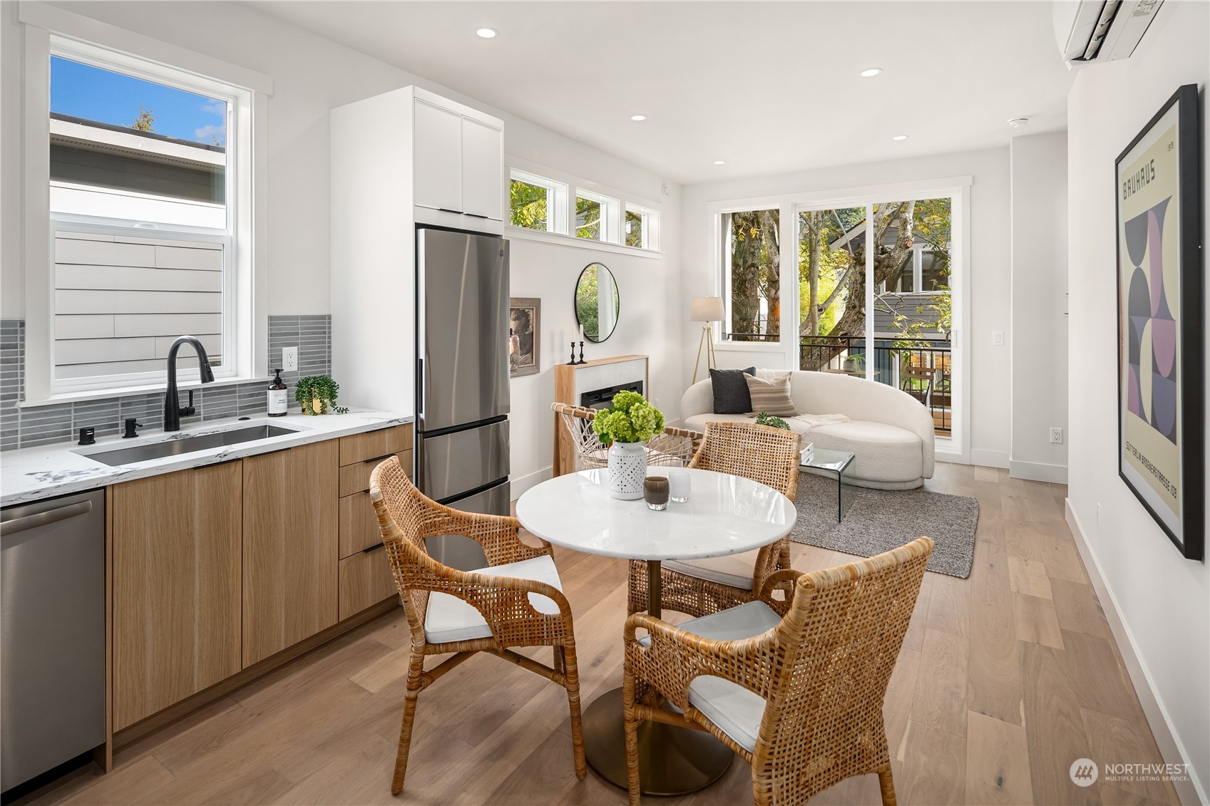 8809 B Wallingford Avenue North Seattle, WA 98103 - Photo 8 of 17 a view of a dining room with furniture window and wooden floor