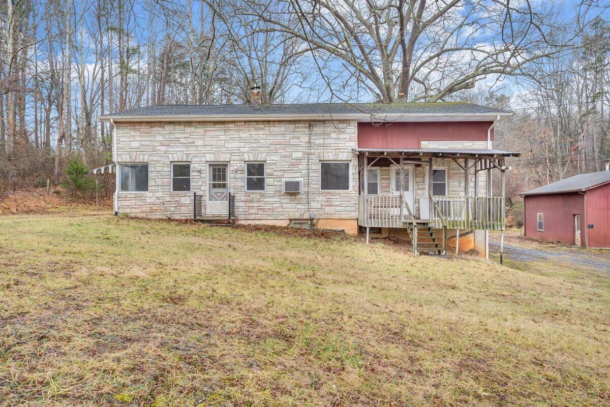 1115 Morgans Mill Road Goodview, VA 24095 - Photo 1 of 50 front view of a house with an trees