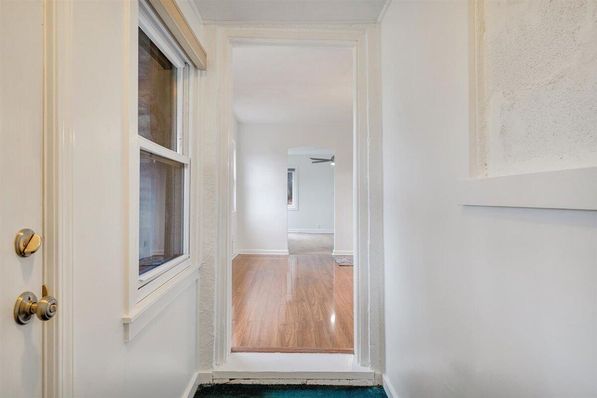 1115 Morgans Mill Road Goodview, VA 24095 - Photo 20 of 50 a view of a hallway with wooden floor and entryway